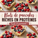 Bols de pancakes protéinés garnis de fruits et de noix, servis sur une table en bois.